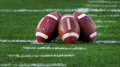 Footballs on ground