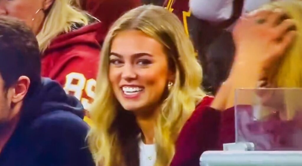 katie miller smiling in stands