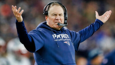 Bill Belichick gesturing with his hands in the air