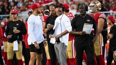 49ers players and coaches on sideline