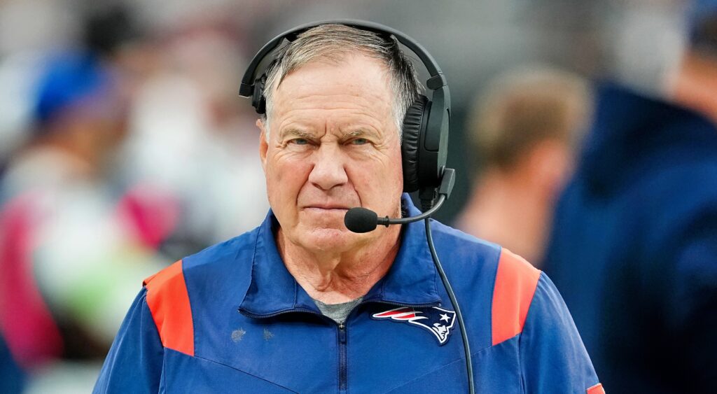 Bill Belichick of New England Patriots looking on.