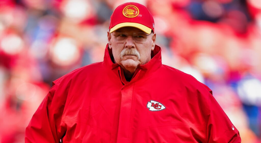 Andy Reid looks on from the field.