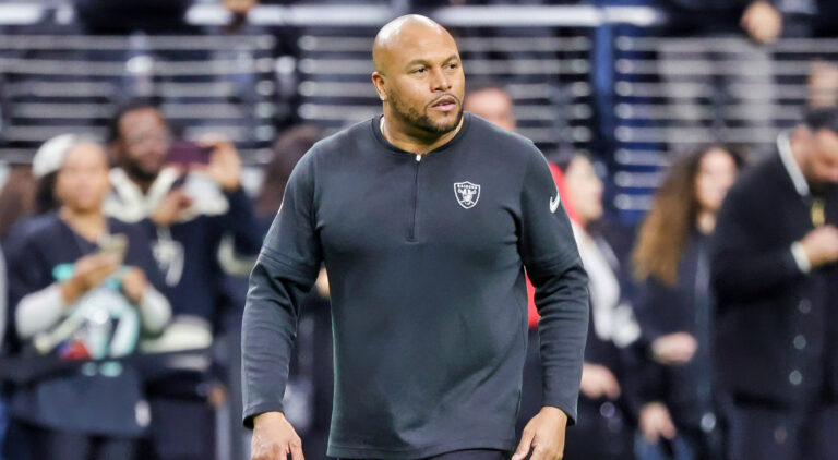 Antonio Pierce in black Raiders shirt