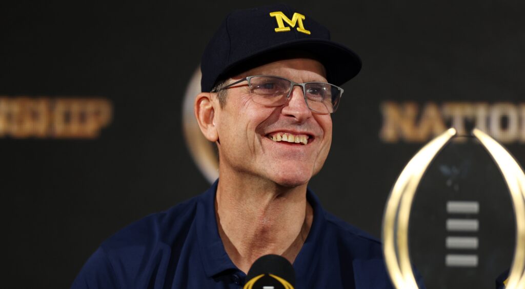 Jim Harbaugh speaking to reporters.