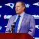 Bill Belichick standing at podium