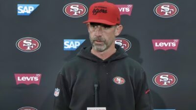 Kyle Shanahan speaking to reporters