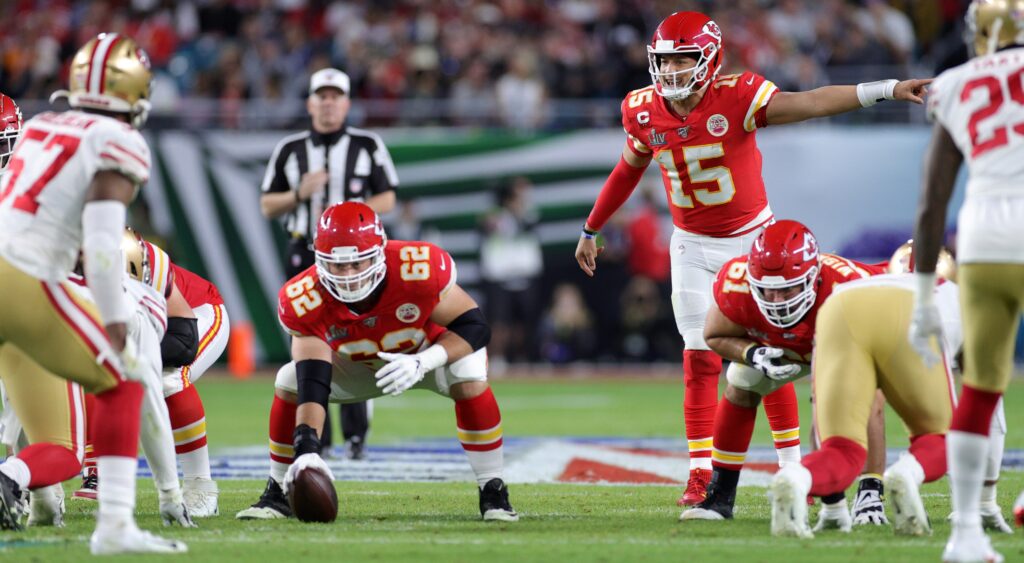 Patrick Mahomes and Chiefs and 49ers players on field