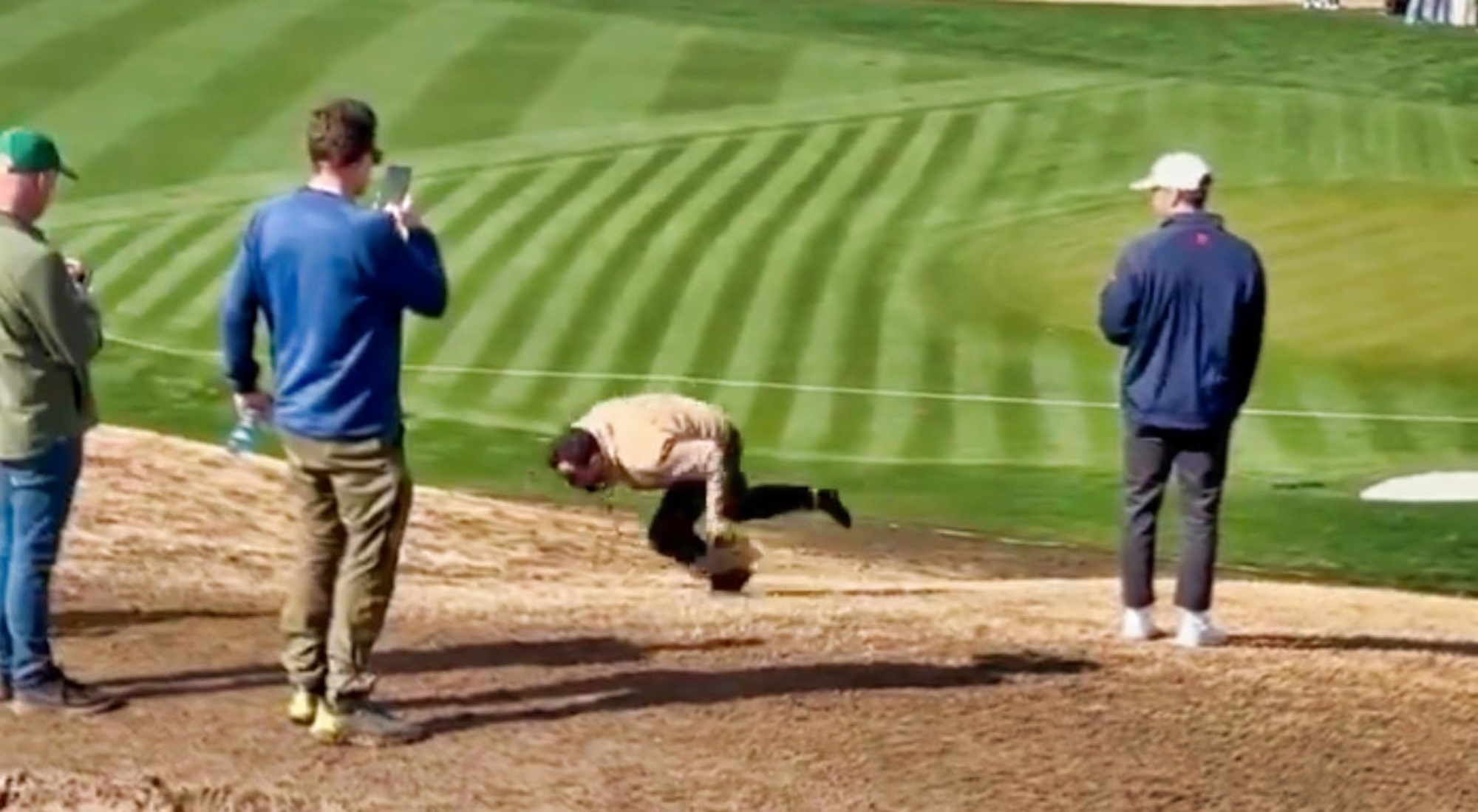 Plastered Fan At PGA Waste Management Open Fell In The Mud