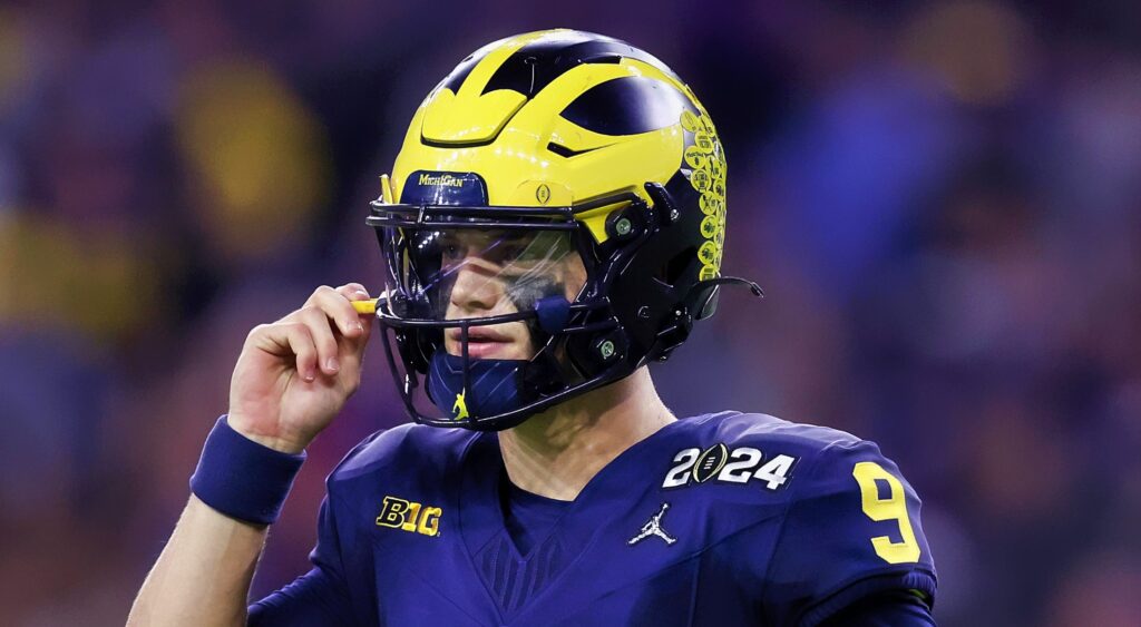 JJ McCarthy of Michigan Wolverines looking on.