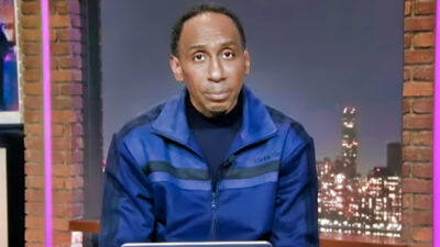 Stephen A. Smith wearing blue and black track suit