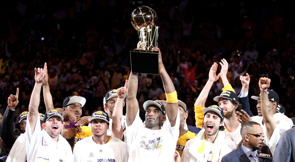 Kobe Bryant holding the NBA award