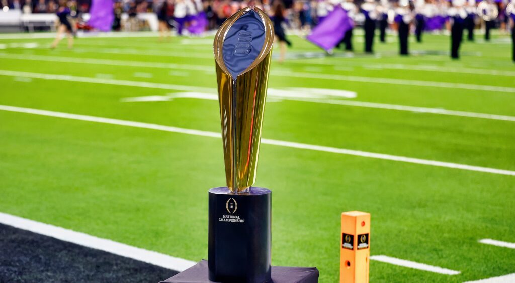 College Football Playoff National Championship Trophy on the field.