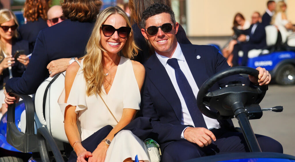 Erica Stoll posing with Rory McIlroy
