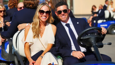 Erica Stoll posing with Rory McIlroy