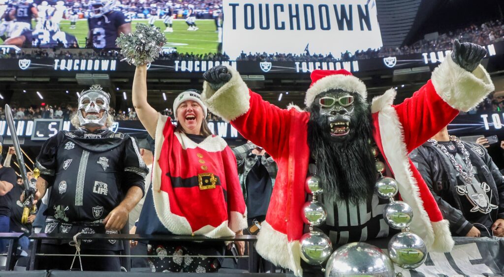 Las Vegas Raiders fans celebrating NFL Christmas game.