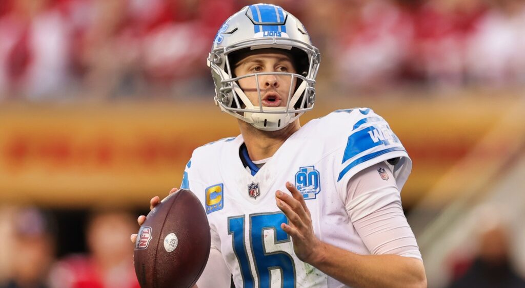 Jared Goff in uniform while holding football