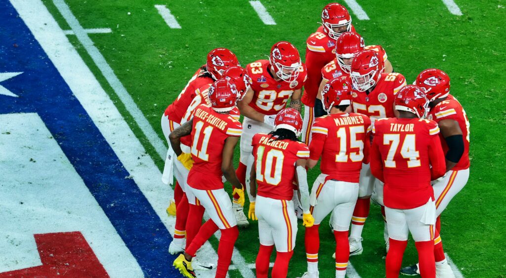 Kansas City Chiefs players in huddle 