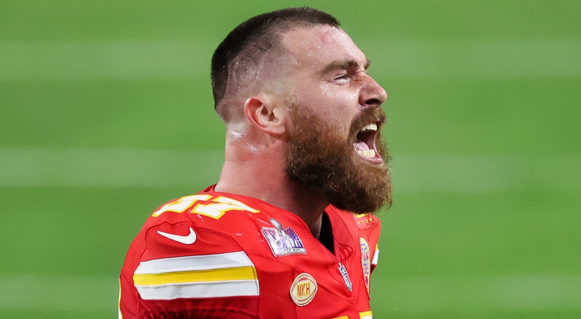 Travis Kelce of Kansas City Chiefs looking on.