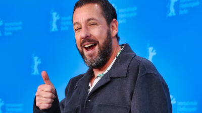 Adam Sandler holding a thumbs up