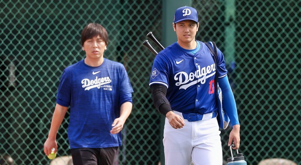 Ippei Mizuhara (left) and Shohei Ohtani (right) looking on.