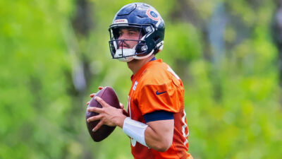 Caleb Williams holding football