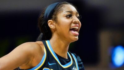 Angel Reese in uniform on the court