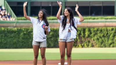 Angel Reese standing next to Kamilla Cardoso.