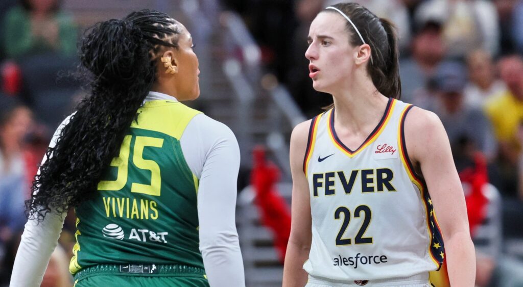Caitlin Clark jawing with Seattle Storm player