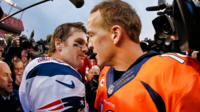 Tom Brady embracing Peyton Manning