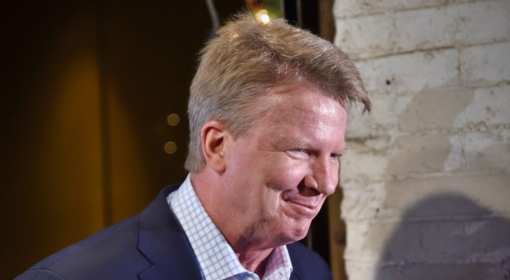 Phil Simms looking on at event.