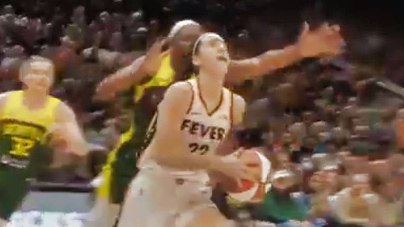 Caitlin Clark of Indiana Fever driving to hoop.