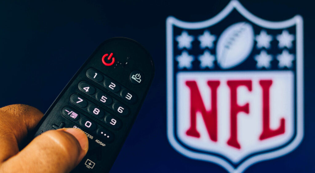 TV remote with NFL logo in the background for article on NFL Total Access