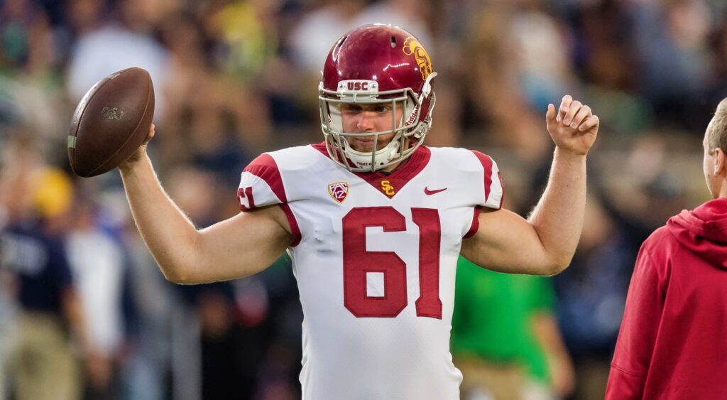 Jake Olson holding a football