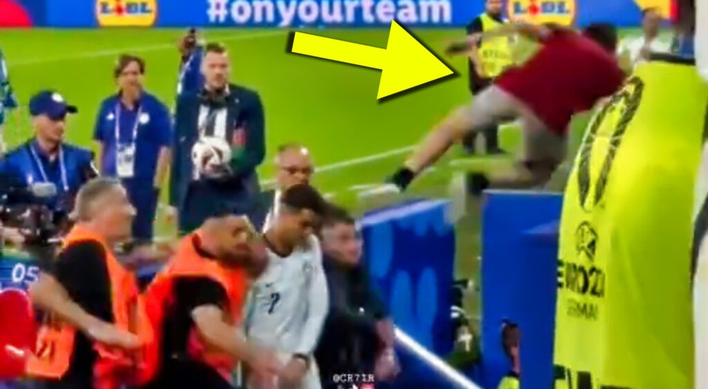 Cray fan jumping out of the stands towards Cristiano Ronaldo at Euro 2024.