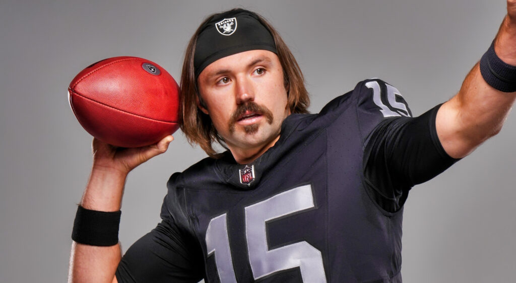 Gardner Minshew holding football