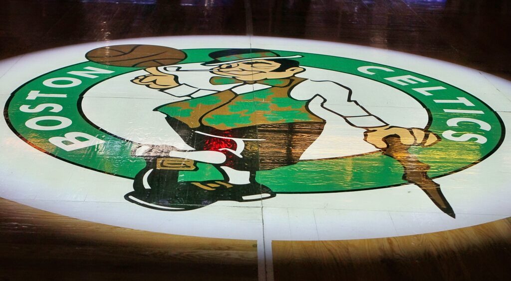 Boston Celtics logo on the hardcourt.