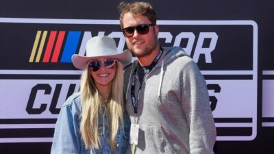 Kelly Stafford and Matt Stafford posing at NASCAR event