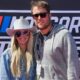 Kelly Stafford and Matt Stafford posing at NASCAR event