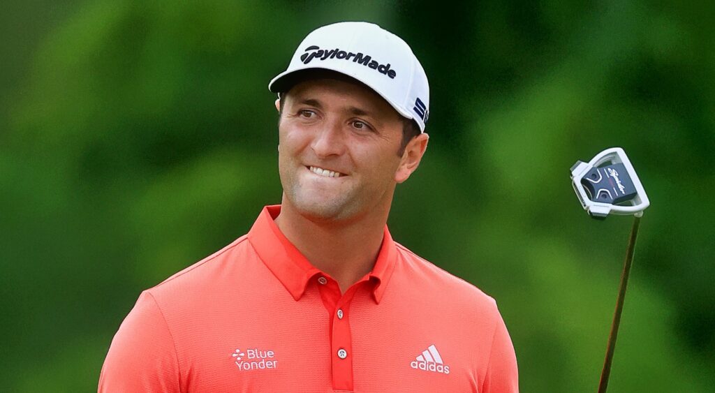 Jon Rahm looking on at golf event.