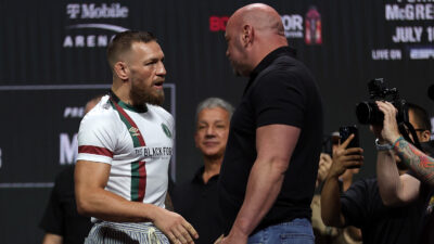 Conor McGregor speaks with UFC President Dana White