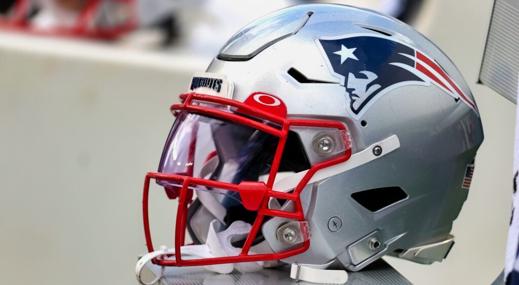 New England Patriots helmet shown on sideline.