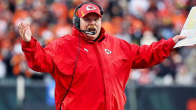 Kansas City Chiefs head coach Andy Reid with his hands in the air