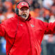 Kansas City Chiefs head coach Andy Reid with his hands in the air