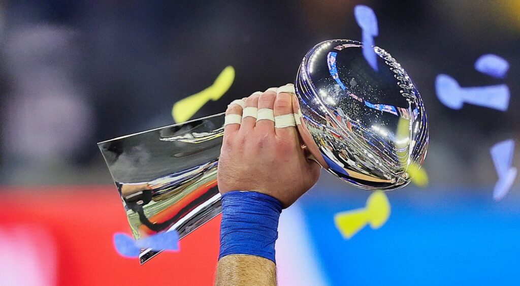 NFL player raises the Vince Lombardi Trophy. Someone recently leaked the NFL Script for the next 5 Super Bowls.