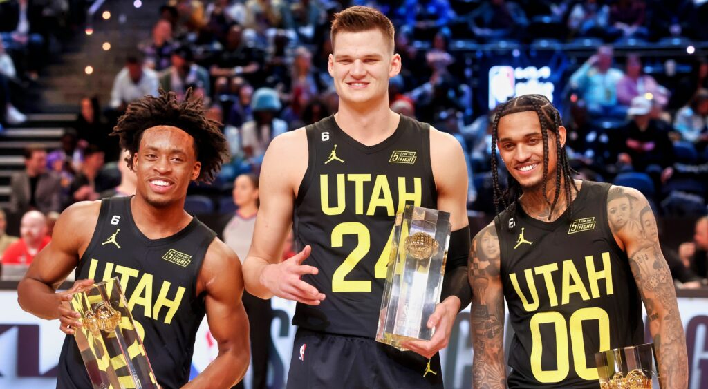 Collin Sexton, Walker Kessler and Jordan Clarkson post with trophies at the NBA All-Star Skills Competition.
