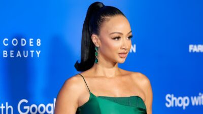 Draya Michele posing in green dress