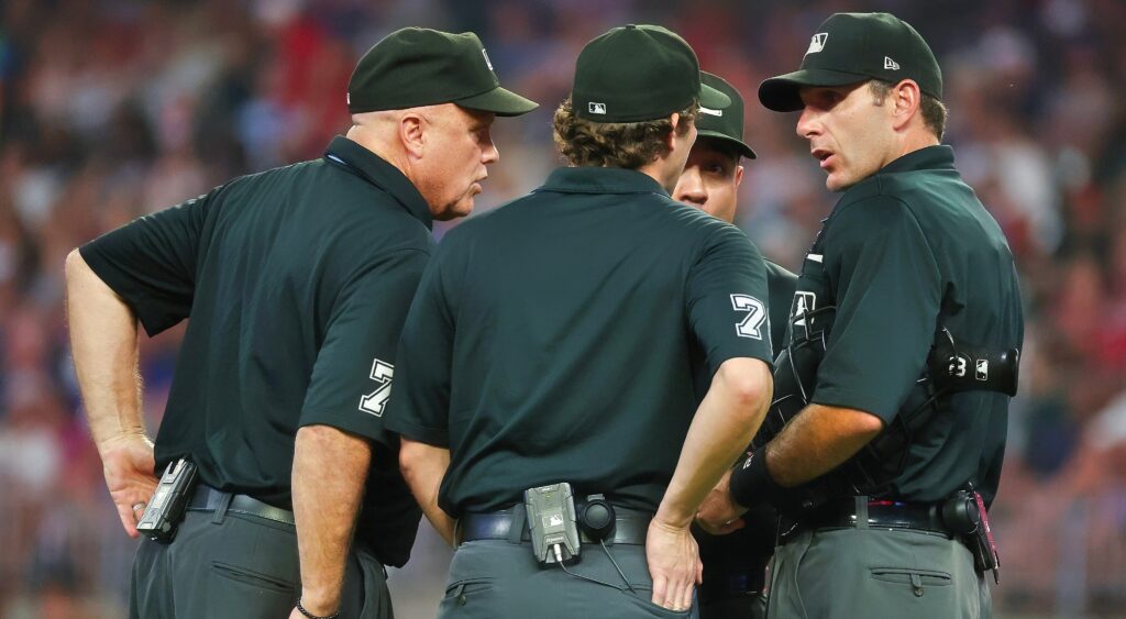  Pat Hoberg with other umpires huddling up