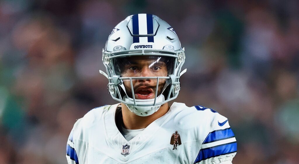 Dak Prescott of Dallas Cowboys looking on.