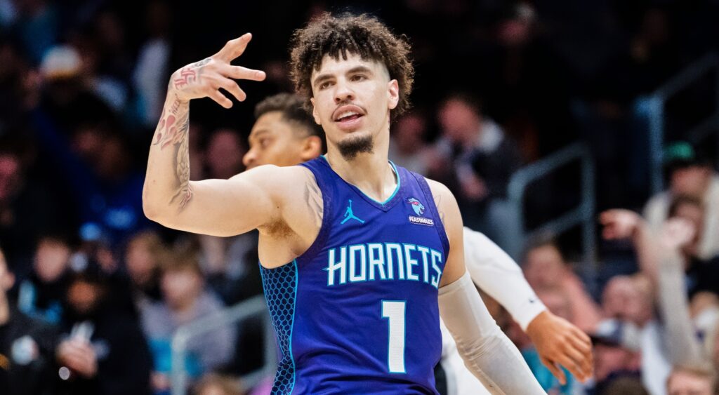 LaMelo Ball does a hand sign during a game.