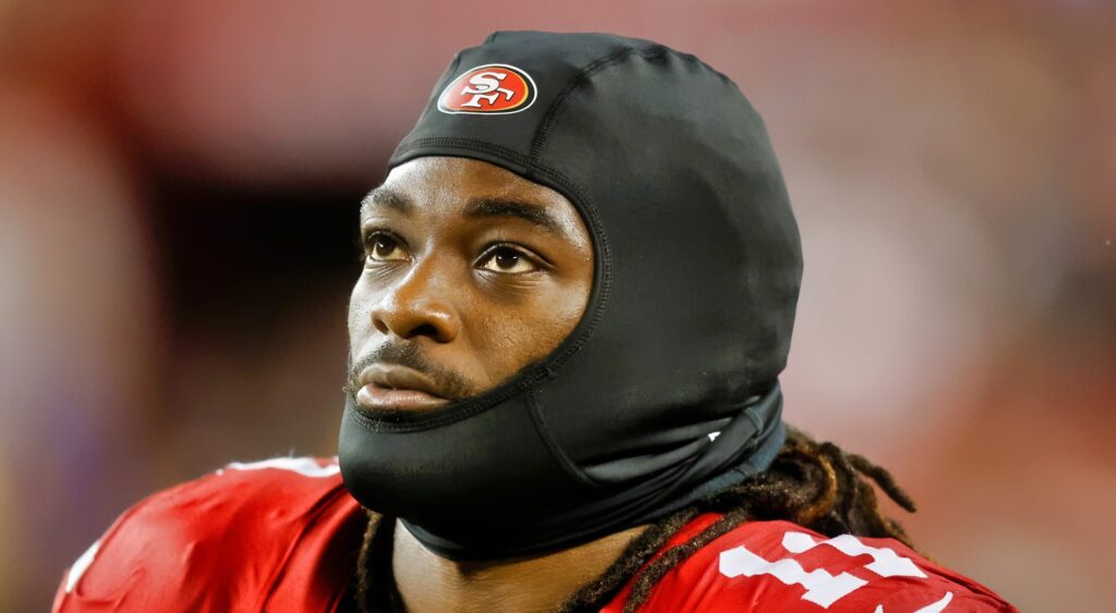 Brandon Aiyuk of San Francisco 49ers looking on.